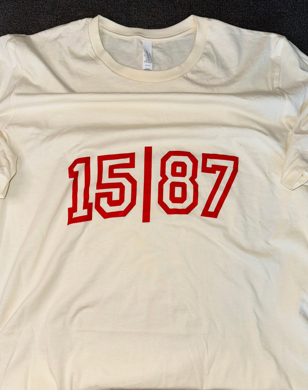 15 | 87 Tee